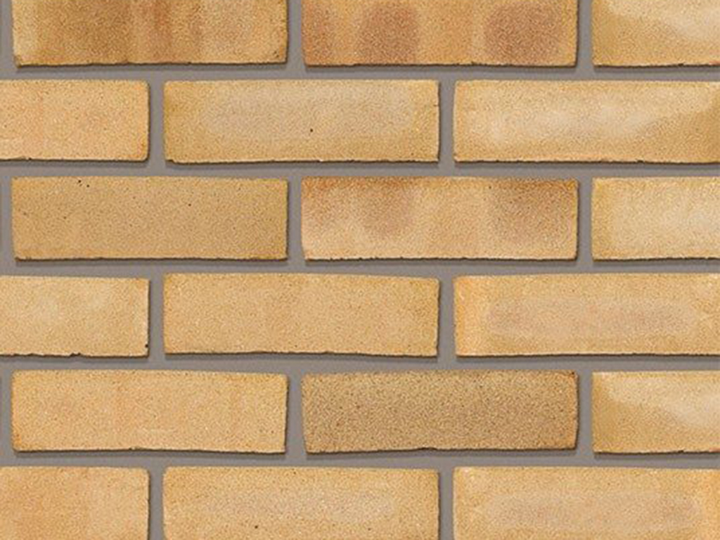 Close up of a wall of Yellow Multi Gilt Stock bricks