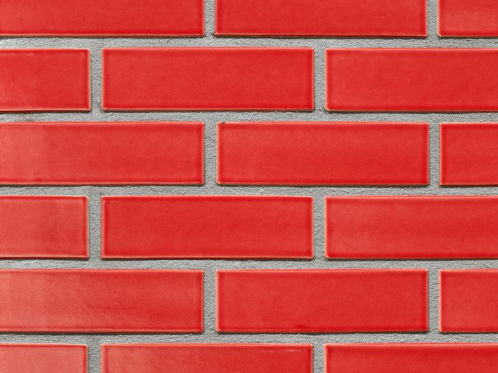 Close up of a wall of Persia Red Glazed bricks