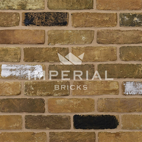 Close up of a wall of Reclamation Yellow Stock bricks