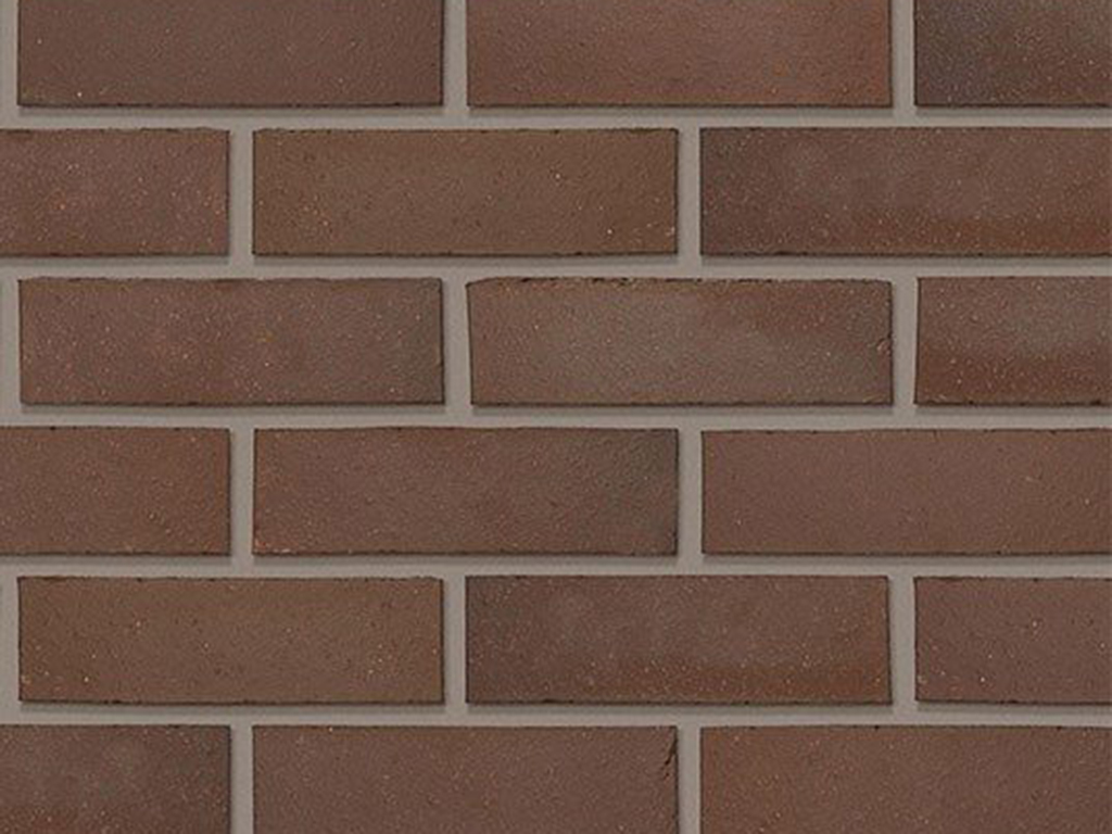 Close up of a wall of Staffordshire Smooth Brown bricks