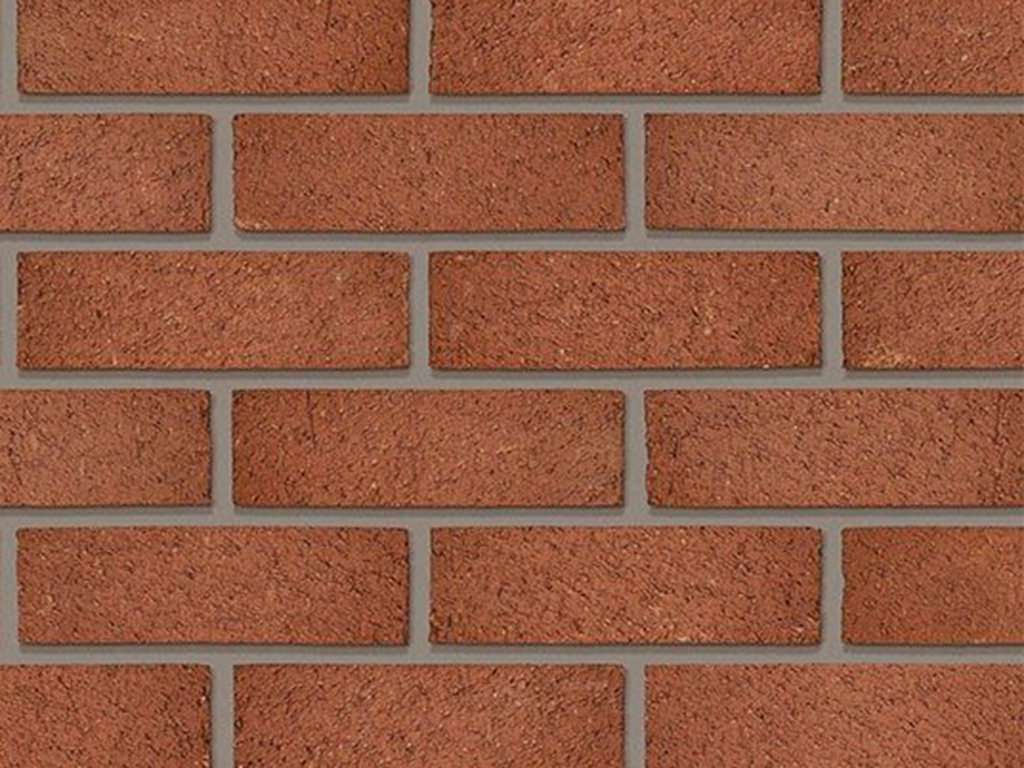 Close up of a wall of Kinder Mixed Red bricks