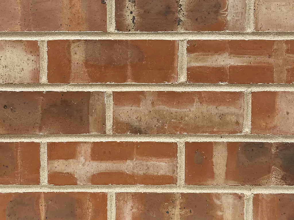 Close up of a wall of Banded Pre War bricks