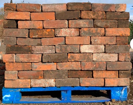 stacked pallet  of reclaimed blended bricks