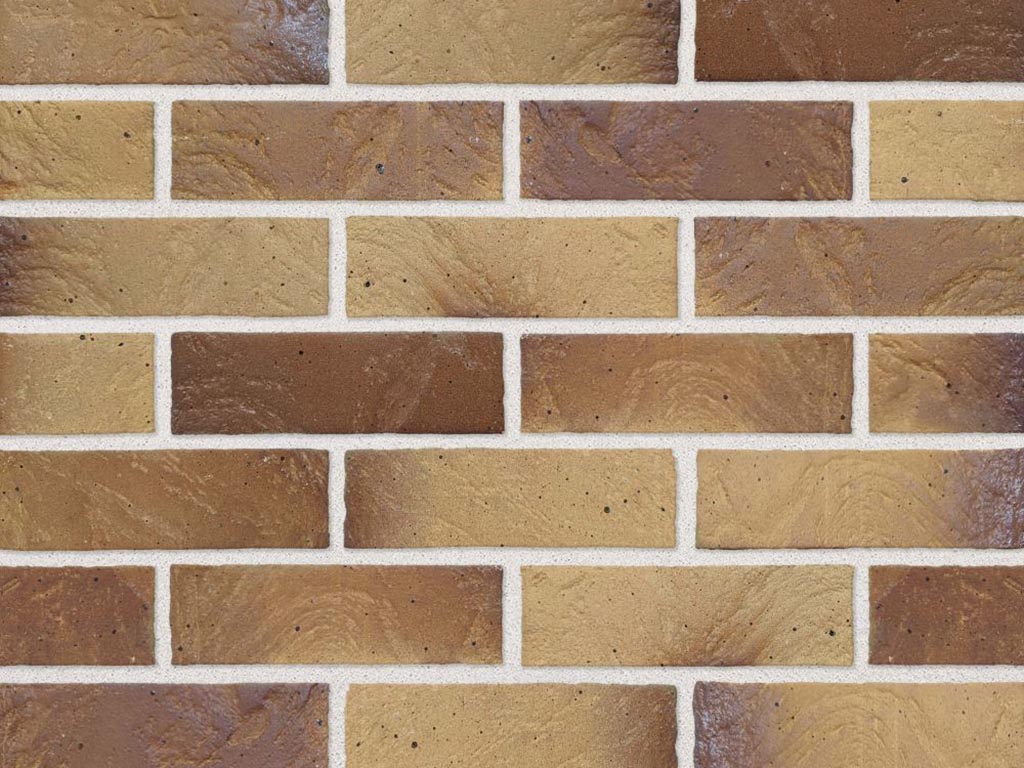 Close up of a wall of Yellow Multi Textured bricks