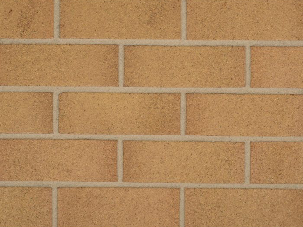 Close up of a wall of Swarland Golden Thatch 73mm bricks