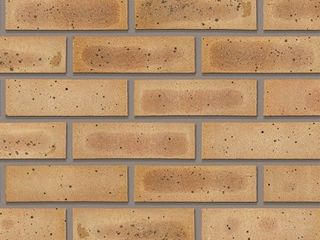 Close up of a wall of Sandalwood Yellow Multi bricks