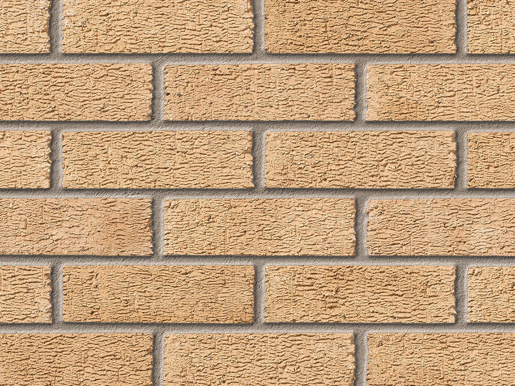 Close up of a wall of Anglian Buff Multi Rustic bricks