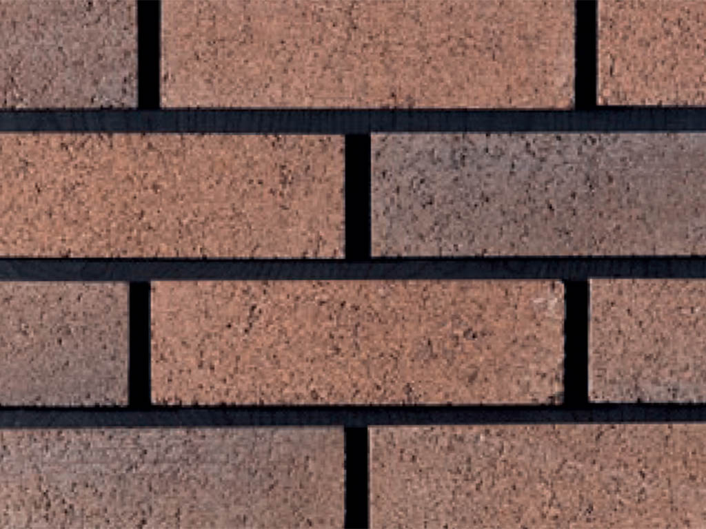 Close up of a wall of Antique Sienna bricks