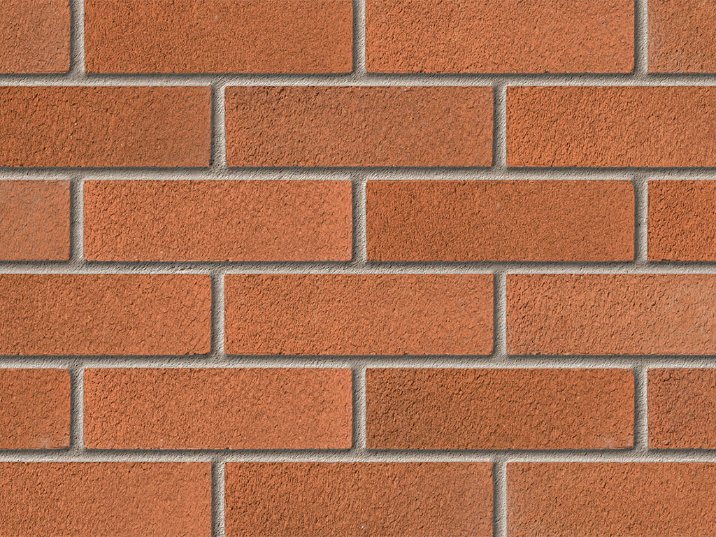 Close up of a wall of Alderley Orange bricks