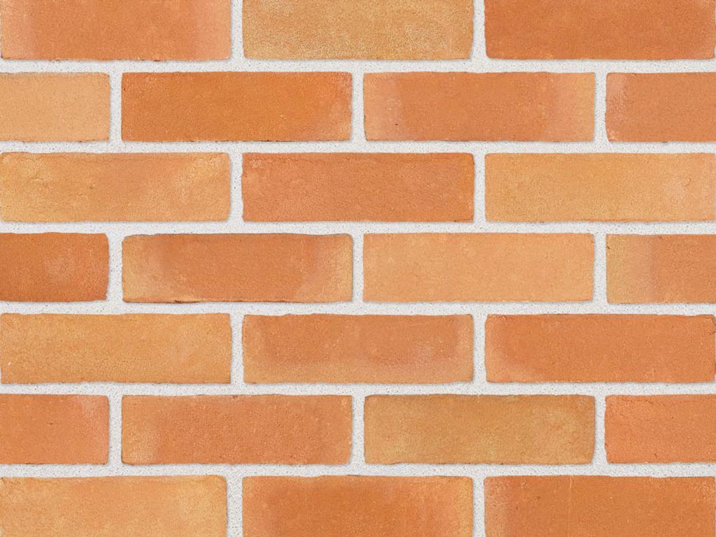 Close up of a wall of Atlas Orange Multi bricks