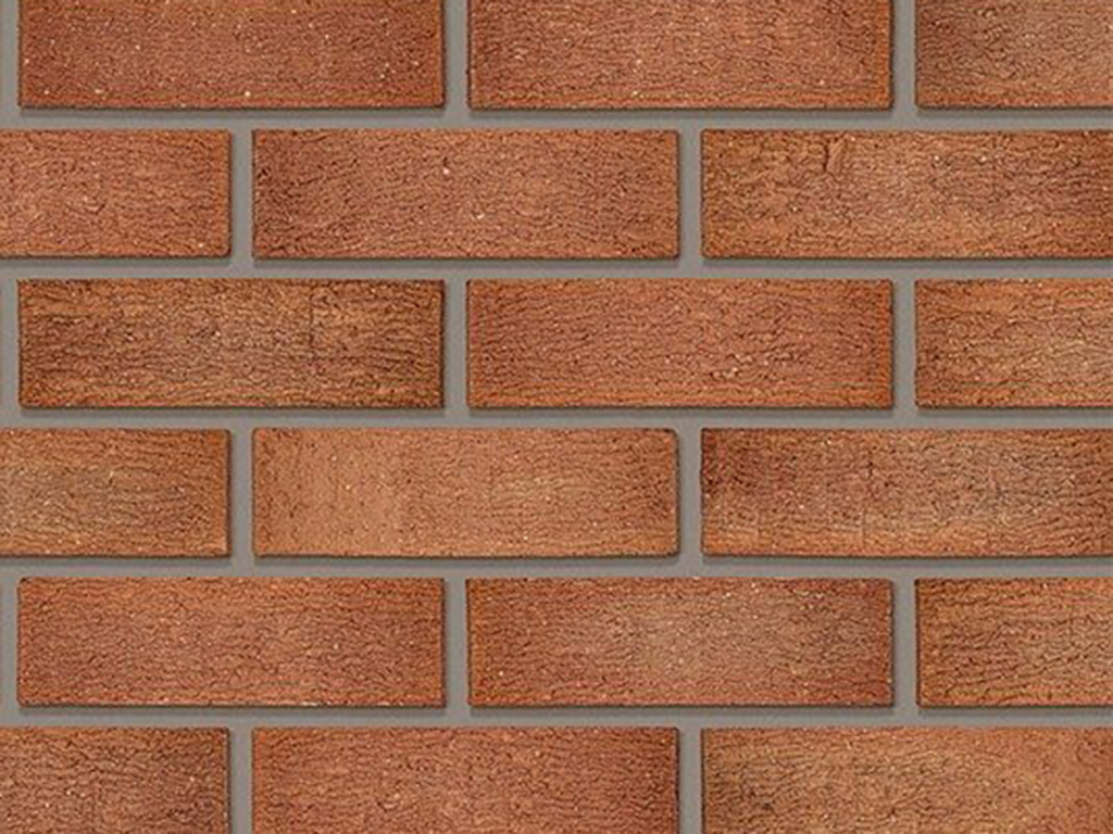 Close up of a wall of Clent Russet Mixture bricks