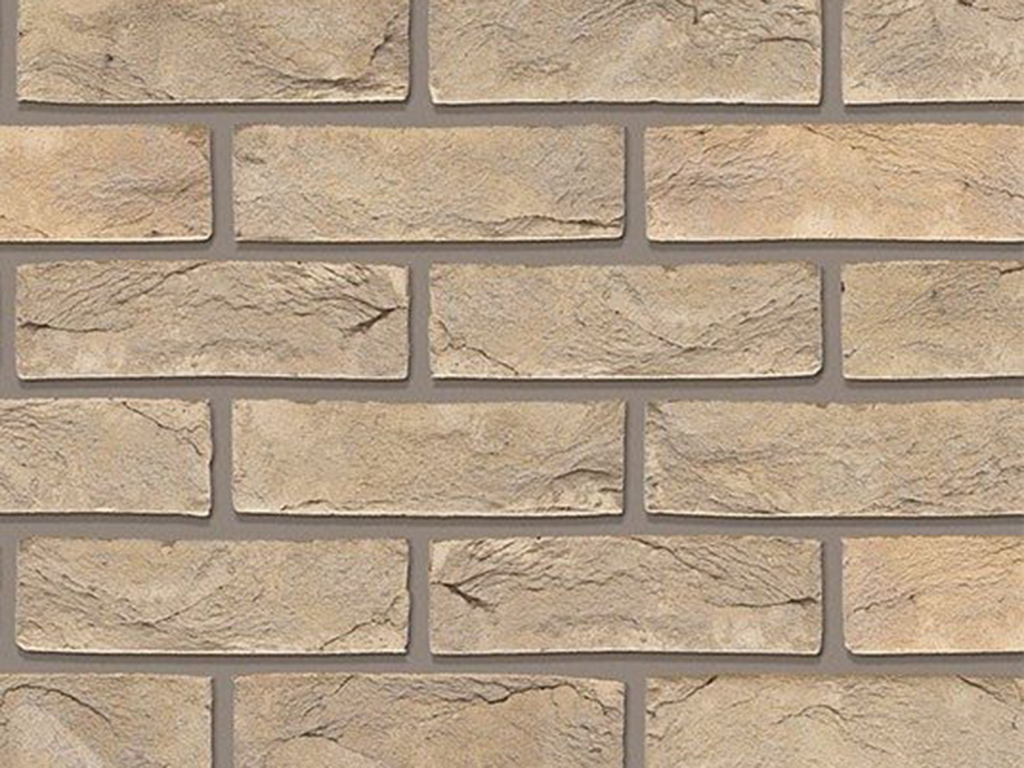 A wall of Anglesey Weathered Buff bricks