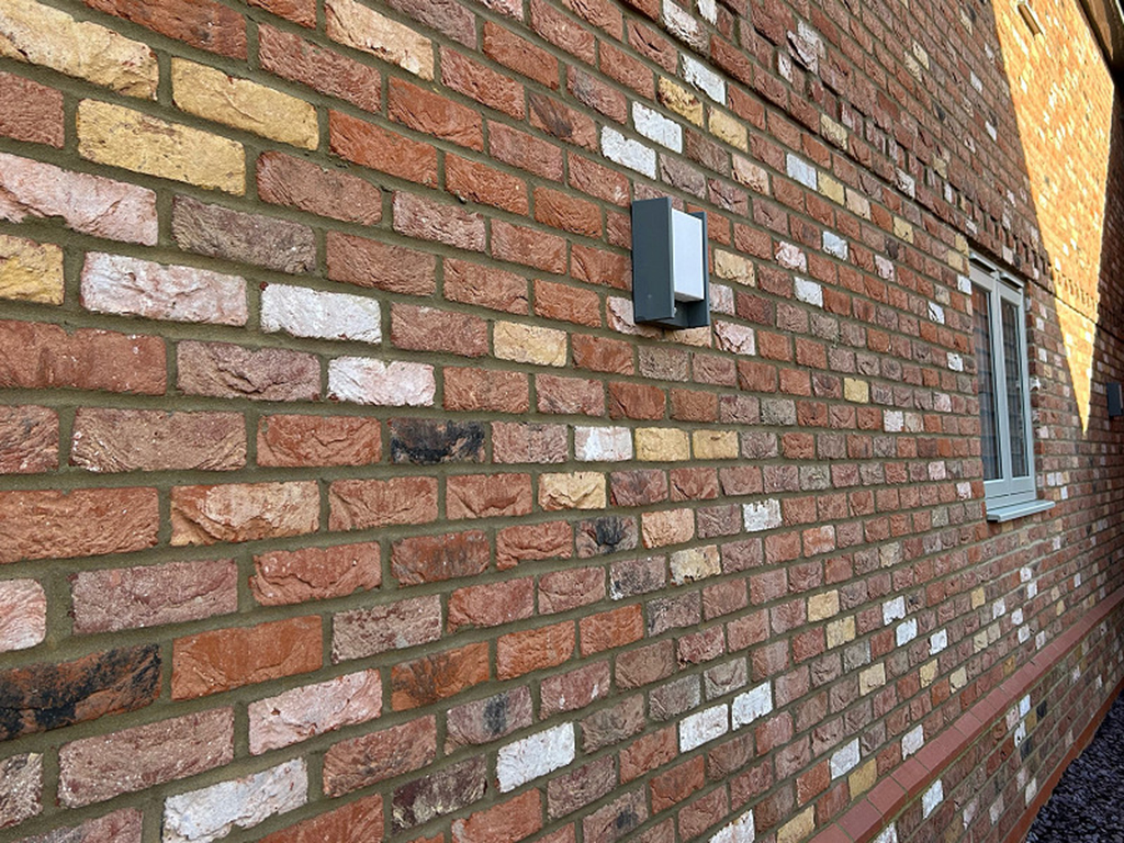 A wall of Barnhouse Blend bricks