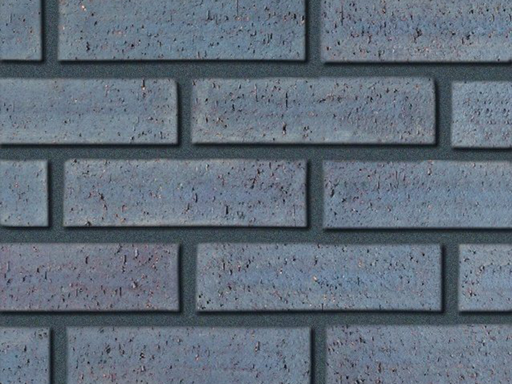 Close up of a wall of Granite Blue Dragfaced bricks