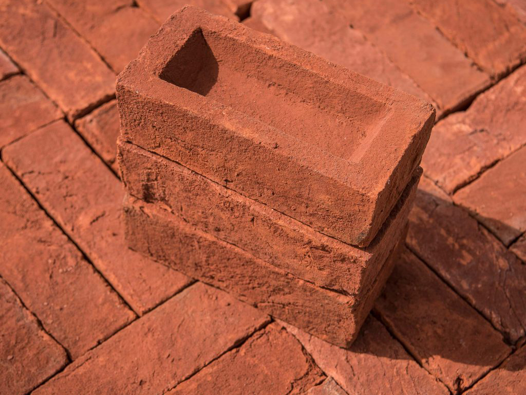 A stack of Plumley Red Handmade bricks