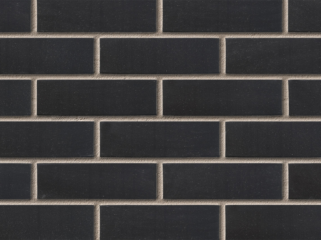 Close up of a wall of Black Smooth bricks