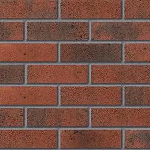 Close up of a wall of Malvern Burnt Mulberry bricks