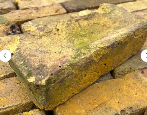 View of single brick of genuine reclaimed london yellow stock