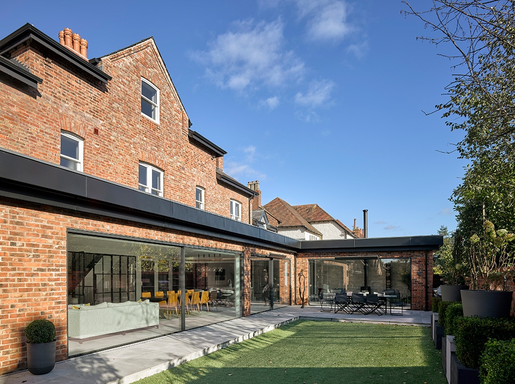A rear view of an Olde Reclamation Shire brick house