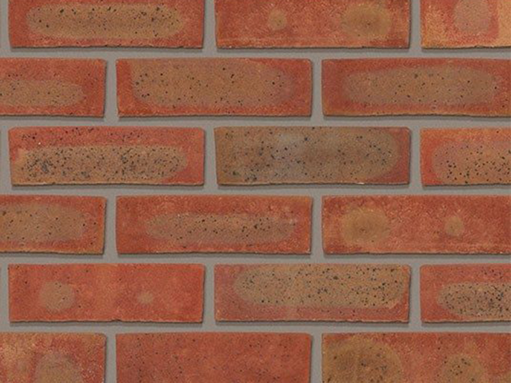 CLose up of a wall of Charthurst Red Multi bricks
