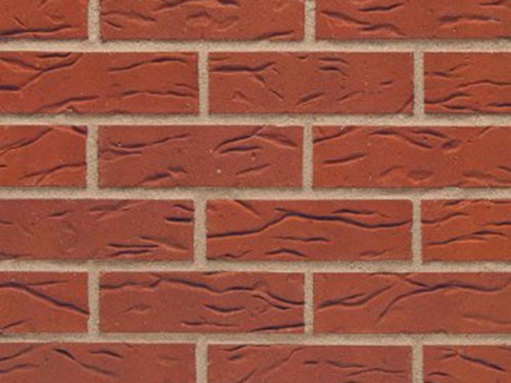 Close up of a wall of Tobago Red bricks