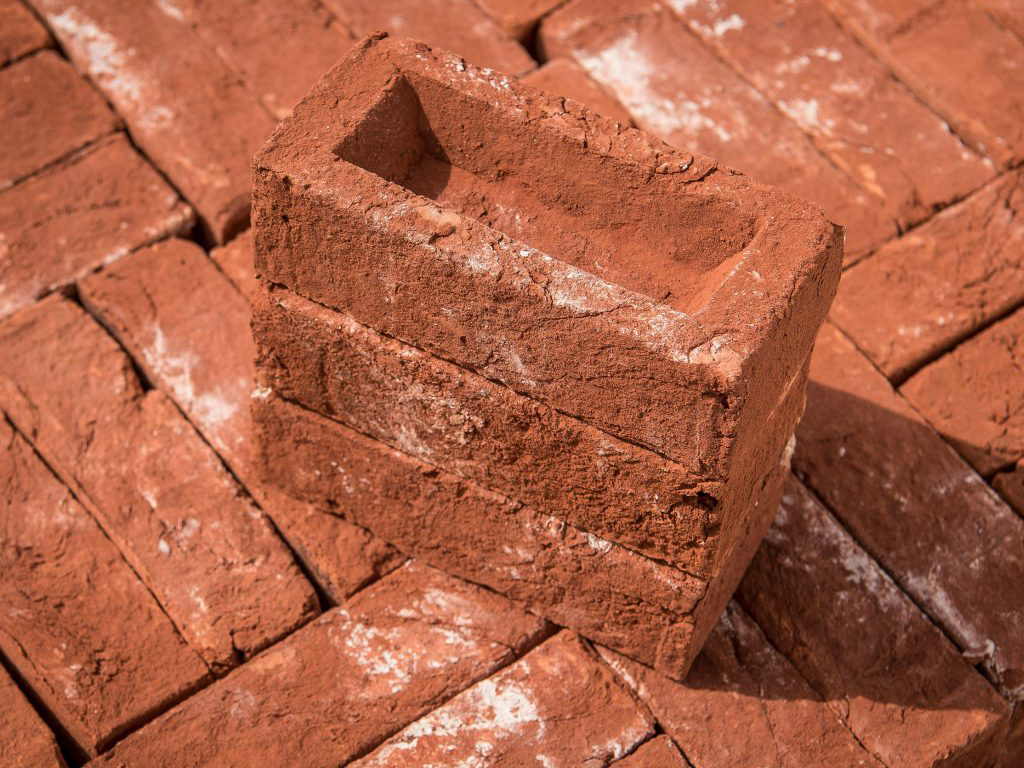 A stack of Old Barn Mix Handmade bricks