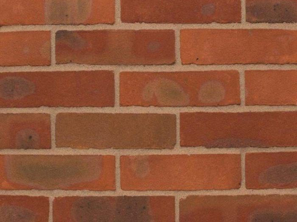 Close up of a wall of Cholesbury Dark Red Multi bricks