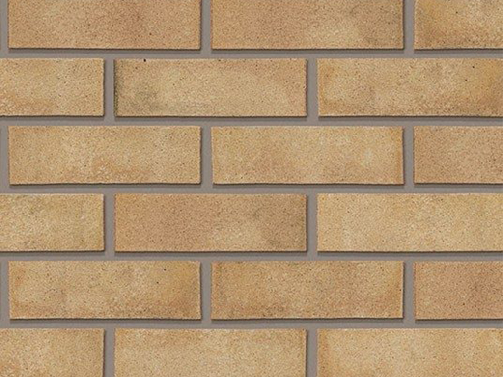 Close up of a wall of Trinity Cream Gilt Stock bricks