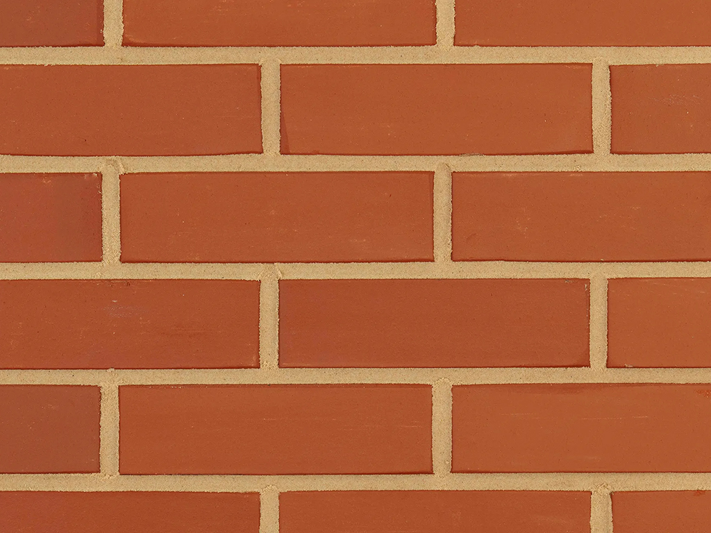 Close up of a wall of Salford Smooth Red bricks