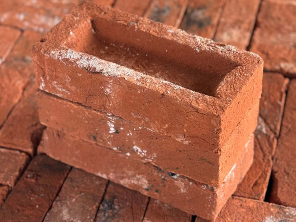 A stack of Old Dark Blend Handmade bricks