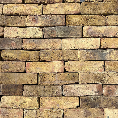Close up of a wall of Reclamation Chiswick Yellow Stock bricks