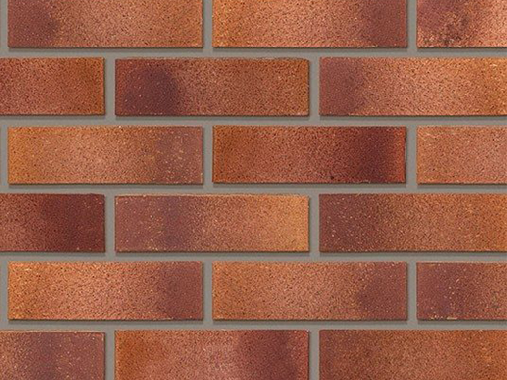 Close up of a wall of Mulberry Red bricks