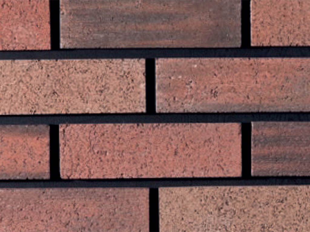 Close up of a wall of Burnt Orange bricks