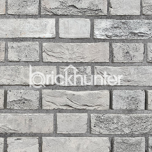 Close up of a wall of Forum Smoked Branco bricks