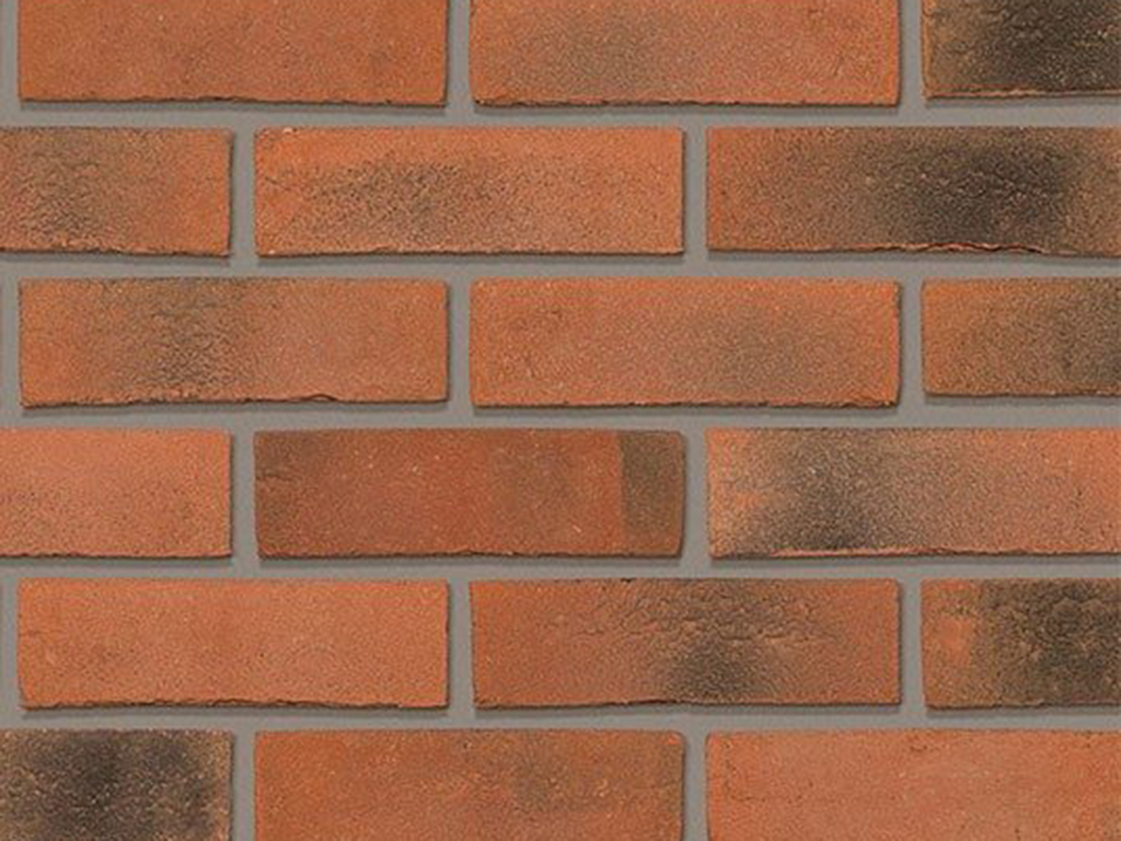 Close up of a wall of Smoked Orange Multi Gilt Stock bricks