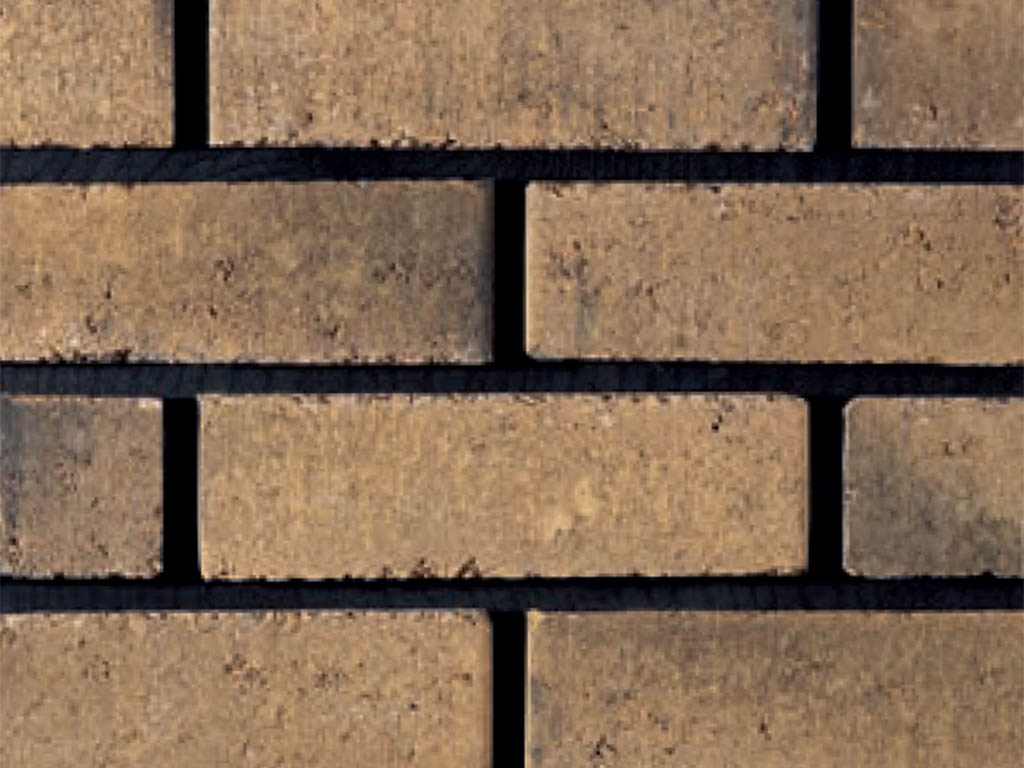 Close up of a wall of Chelsea Yellow bricks