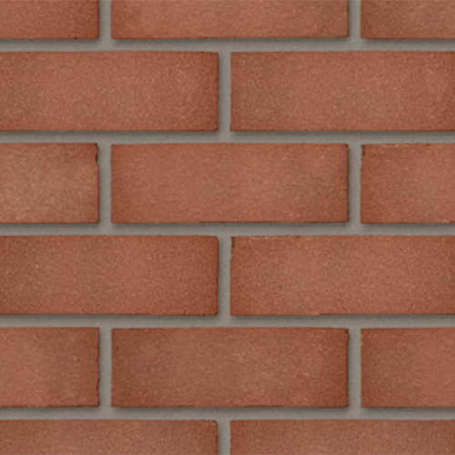 CLose up of a wall of Swarland Red Sandfaced 73mm bricks