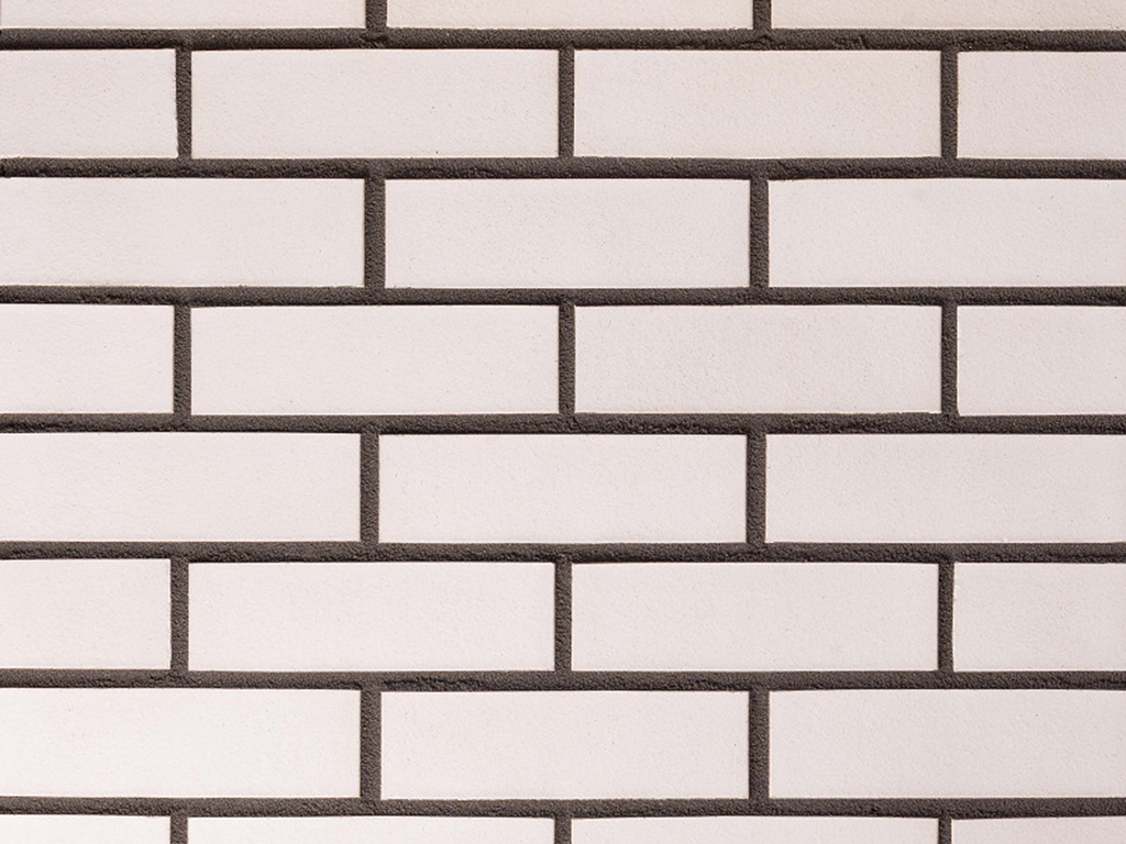 Close up of a wall of Andalusia White bricks