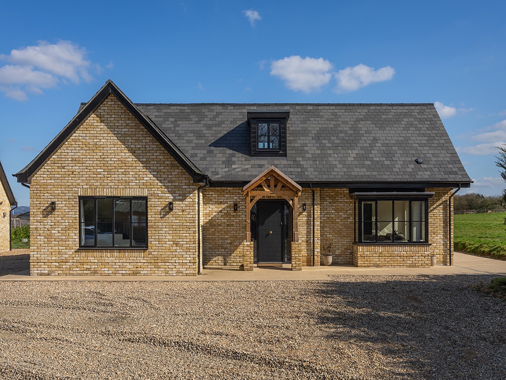 A Tumbled Reclamation Buff brick house
