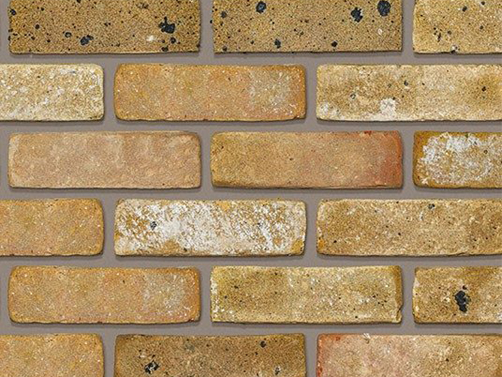 Close up of a wall of Smeed Dean Islington Yellow Rustica bricks