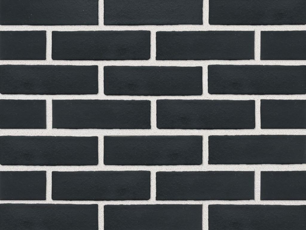 Close up of a wall of Black Smooth bricks