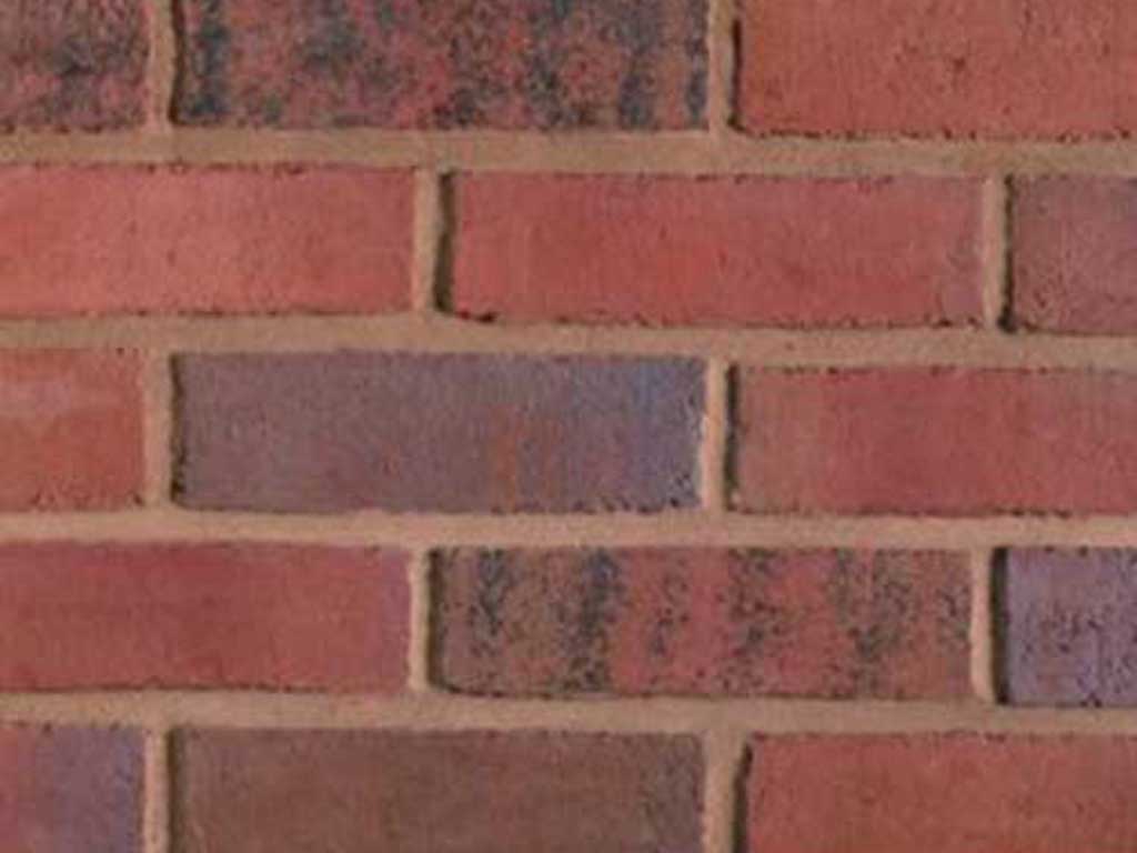 Close up of a wall of Castillian Russet Sovereign Stock bricks