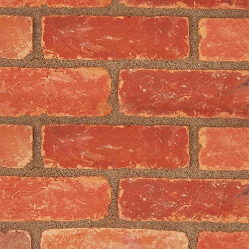 Close up of a wall of Handmade Assorted Reclaim bricks