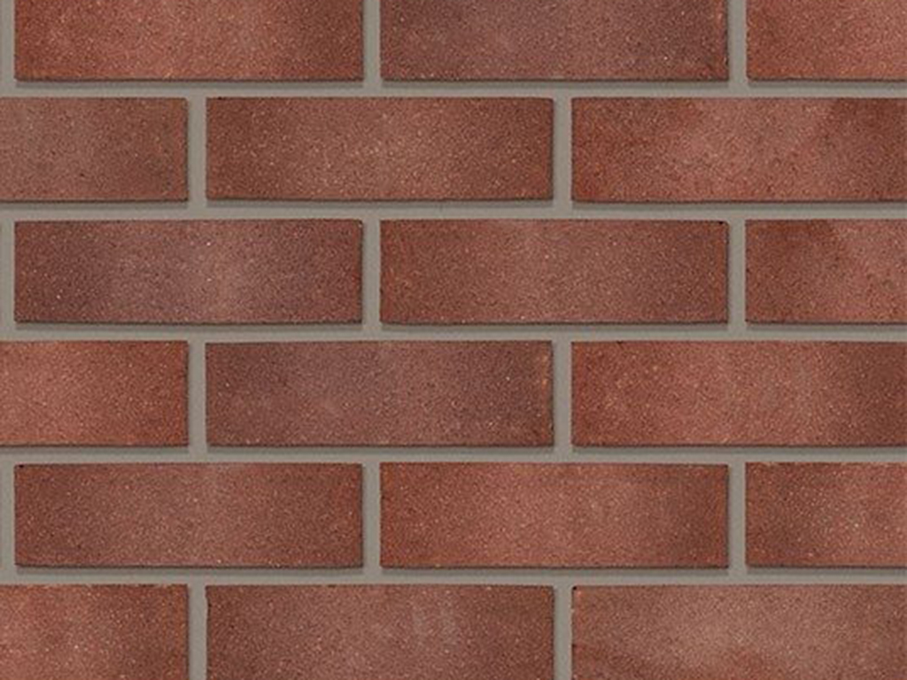 Close up of a wall of Swarland Purple Sandfaced bricks