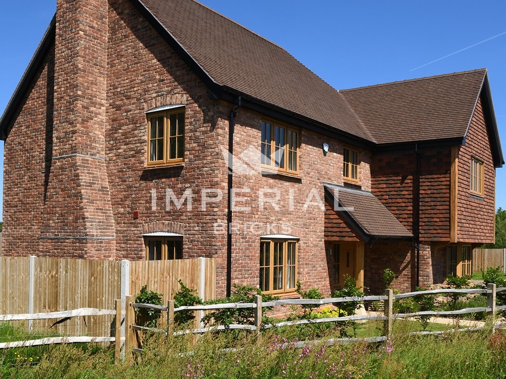 An exterior of a house built using Tumbled Reclamation Red bricks
