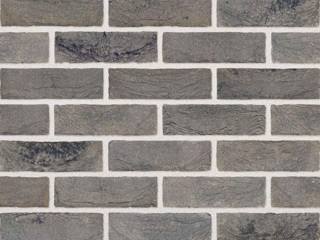 Close up of a wall of Olympus Grey bricks
