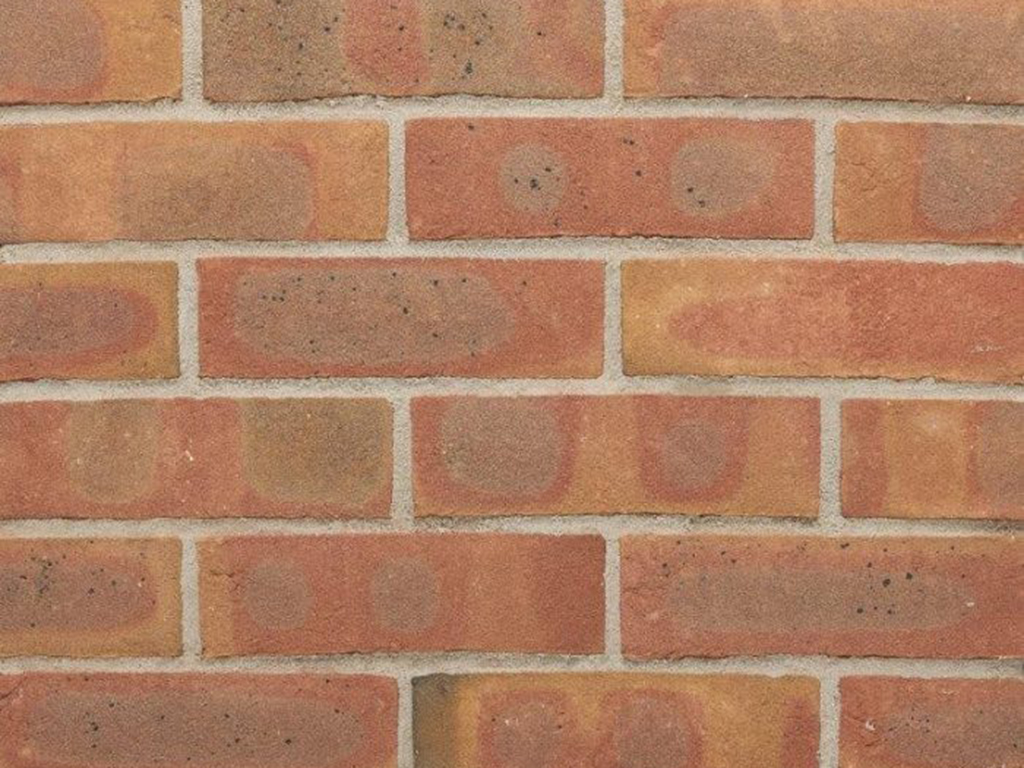 Close up of a wall of Nuthurst Red Multi bricks