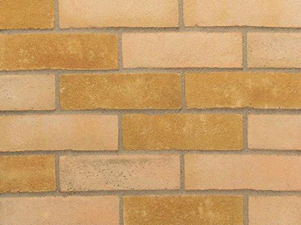 Close up of a wall of Kensington Yellow bricks