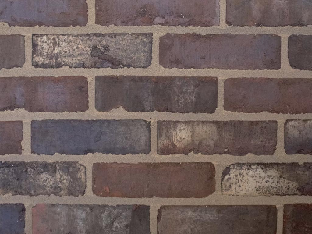 CLose up of a wall of Clamp Tudor Black bricks