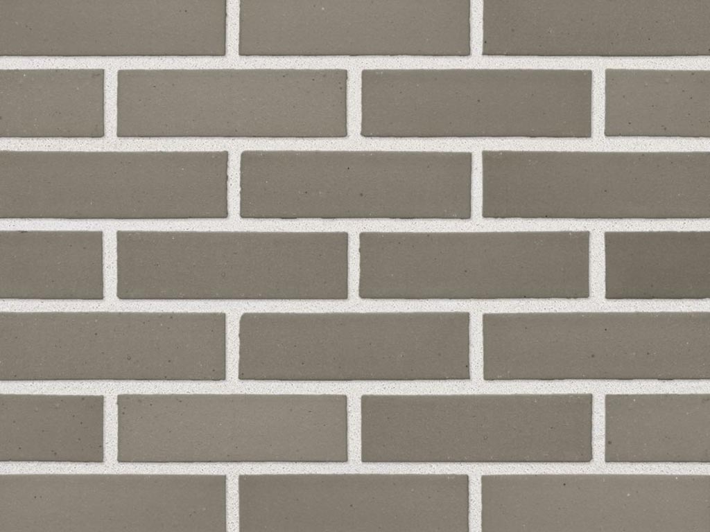 Close up of a wall of Grey Smooth bricks
